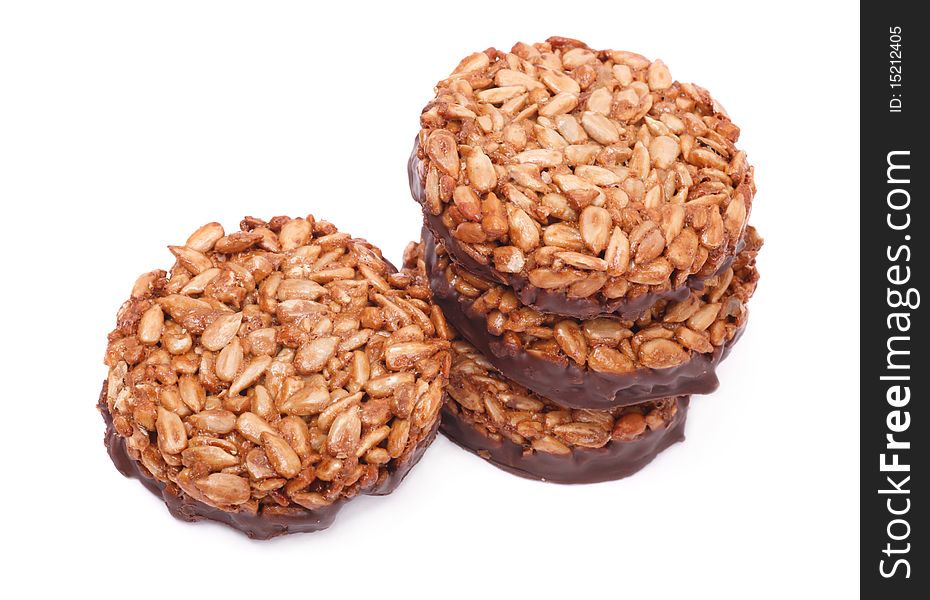Cookies from sunflower seeds and chocolate on a white background