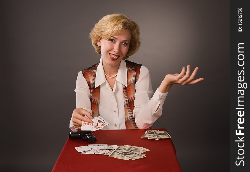 The pretty woman with cards on a grey background