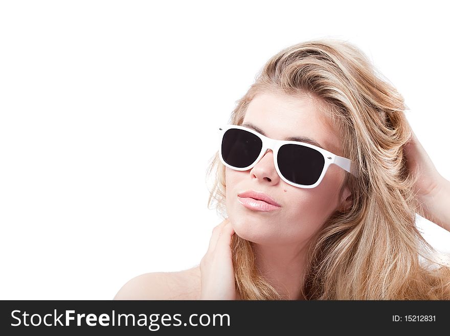 Closeup portrait of beautiful blonde woman in glasses holding head with hands