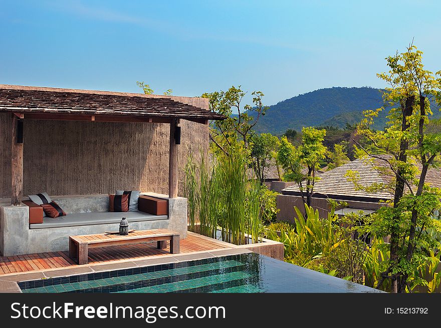 Terrace with swimming pool beside mountain