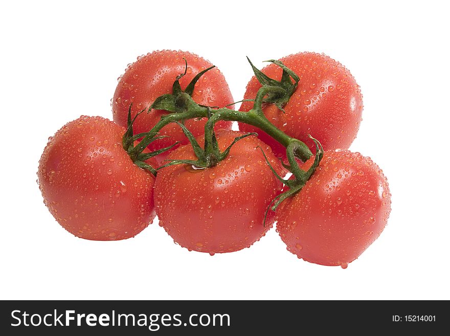 Group Of Ripe Tomatoes With Leaf On A Stem