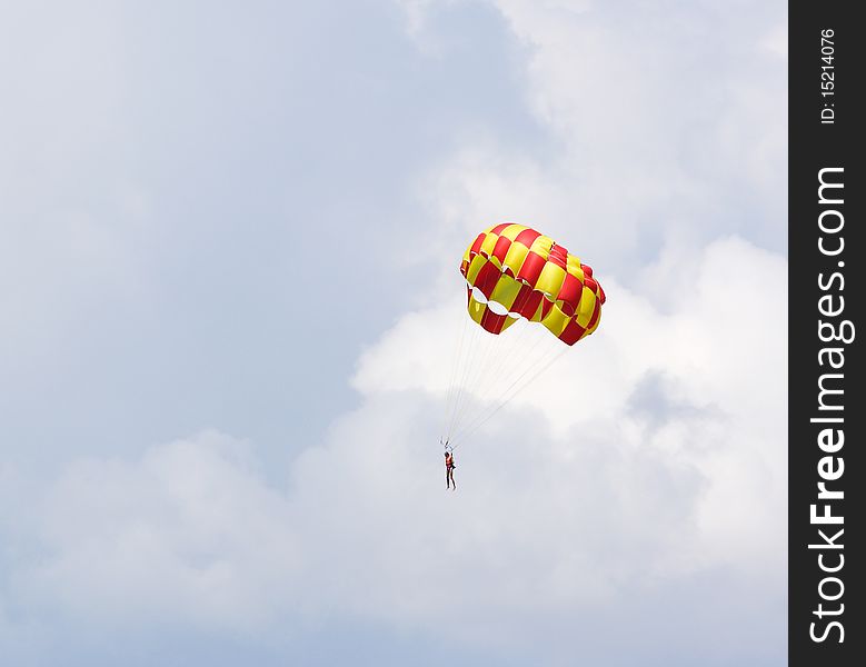 The image of skydiver flies with parachute