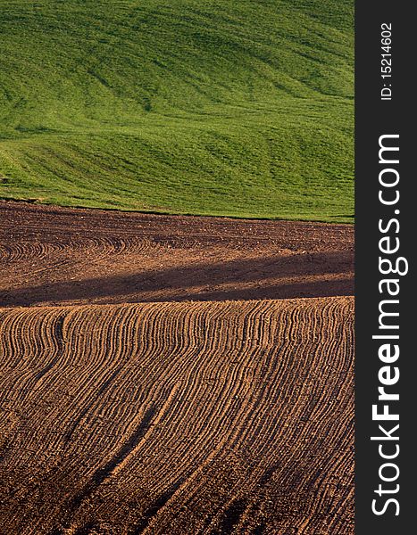 The freshly ploughed brown field. The freshly ploughed brown field