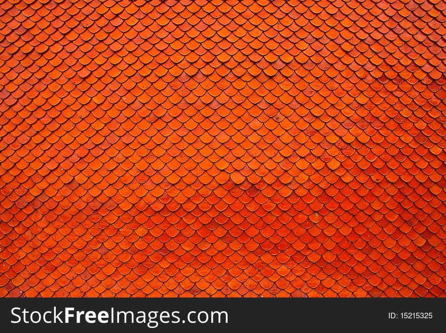 Orange brown clay roof texture in wide shot. Orange brown clay roof texture in wide shot