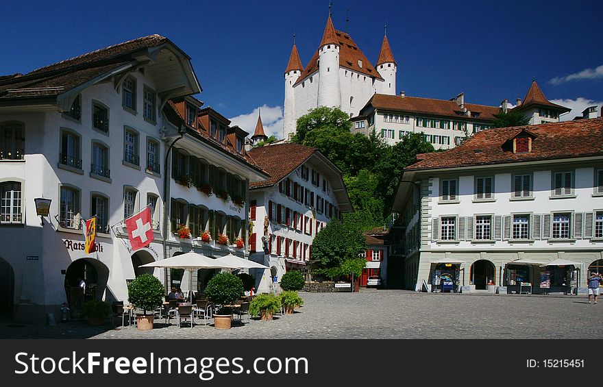 A view from the market square, with the castle in the back, of the old Swiss town of Thun on the Aare River.