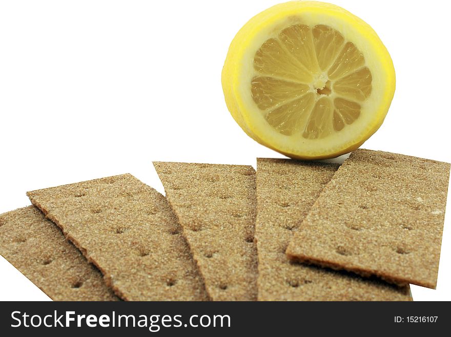 Crackling bread is spread out in the form of a fan, and on it the lemon. Crackling bread is spread out in the form of a fan, and on it the lemon