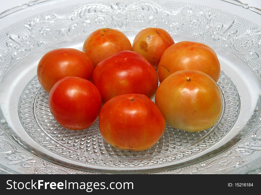Tomatoes are red, yellow, sour, pulpy edible fruits containing vitamin C and beta-carotene. Tomatoes are red, yellow, sour, pulpy edible fruits containing vitamin C and beta-carotene