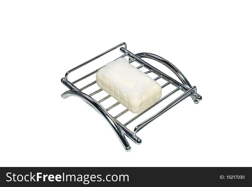 Isolated soap on a metal soap tray. Isolated soap on a metal soap tray