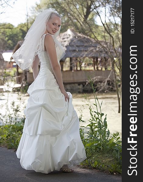 Portrait of happy young bride posing outdoor. Portrait of happy young bride posing outdoor