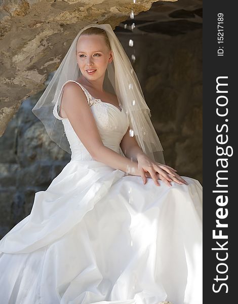 Portrait of happy young bride sitting outdoor. Portrait of happy young bride sitting outdoor