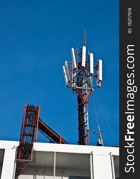 Cellphone Transmitter over the roof of building in Khon Kaen, Thailand.