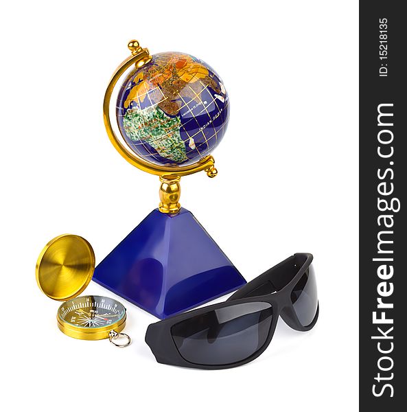 Sunglasses, compass and globe - travel concept