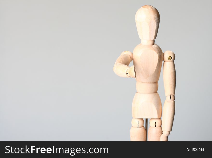 Wooden doll on the white background