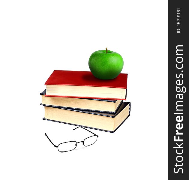 Image of books and apple with eye glasses