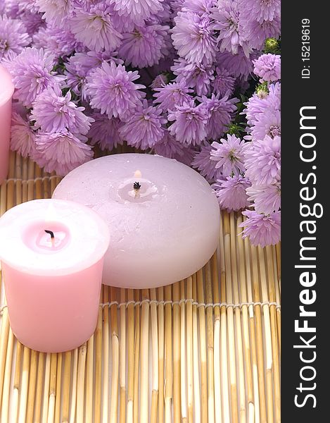 Spa candles and pink flower. Spa candles and pink flower