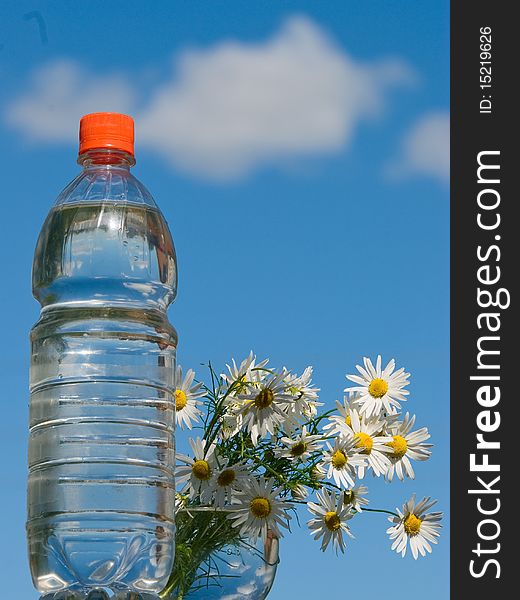 Bottle plastic against the blue sky flows