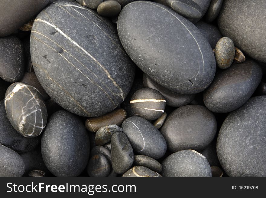 Different shapes pebble on a tropical beach. Different shapes pebble on a tropical beach