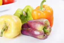 Purple, Yellow, Orange & Green Baby Bell Peppers Stock Images Purple, Yellow, Orange & Green Baby Bell Peppers Stock Images