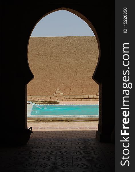 Water pours into a swimming pool in a desert hotel. Water pours into a swimming pool in a desert hotel.