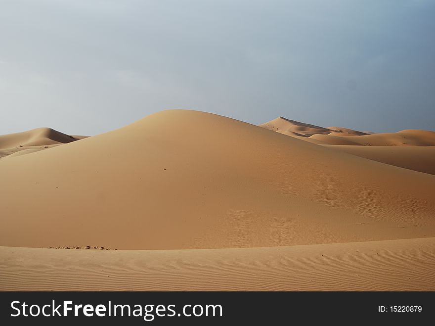 Sahara desert scenery with unspoilt and undisturbed sand dunes in Morocco.