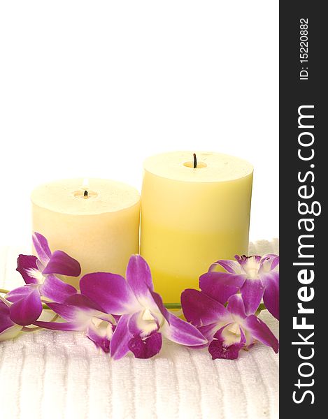 Pink orchid Flower and candles on white. Pink orchid Flower and candles on white