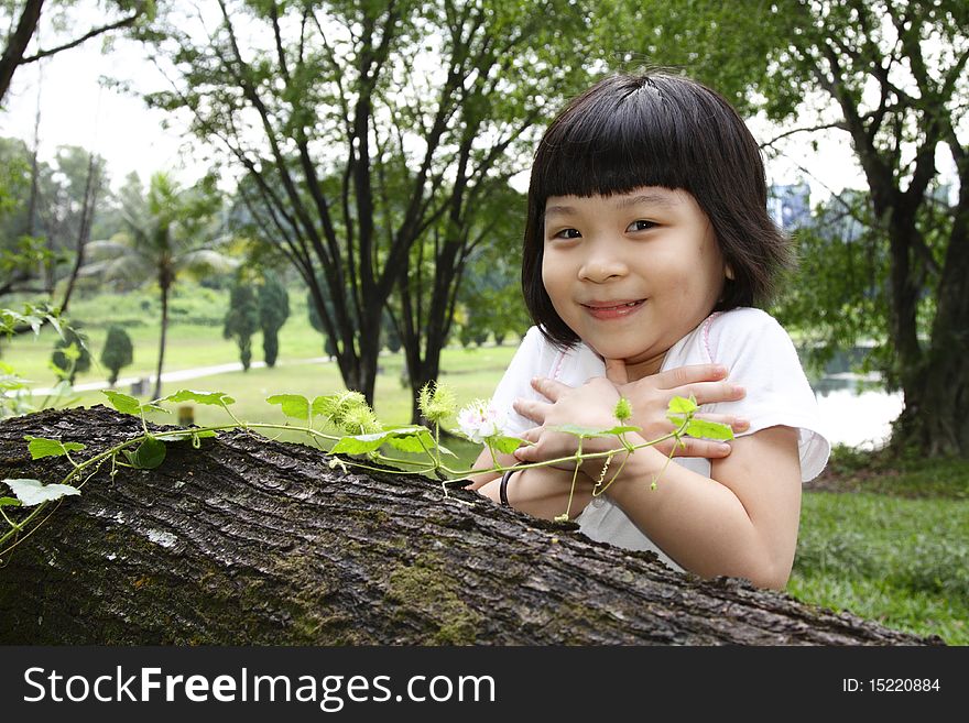 An Asian girl and a creeper plant. An Asian girl and a creeper plant