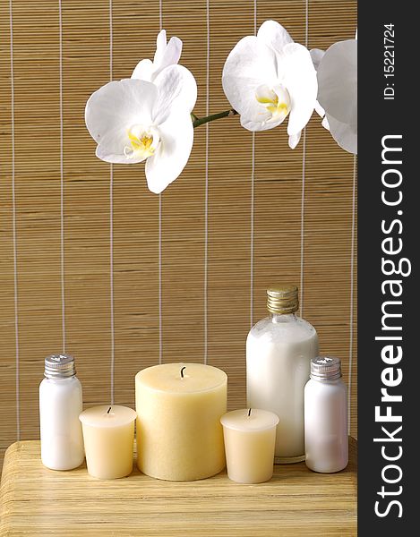 Relaxing spa with candles orchids ,oils on wooden background. Relaxing spa with candles orchids ,oils on wooden background