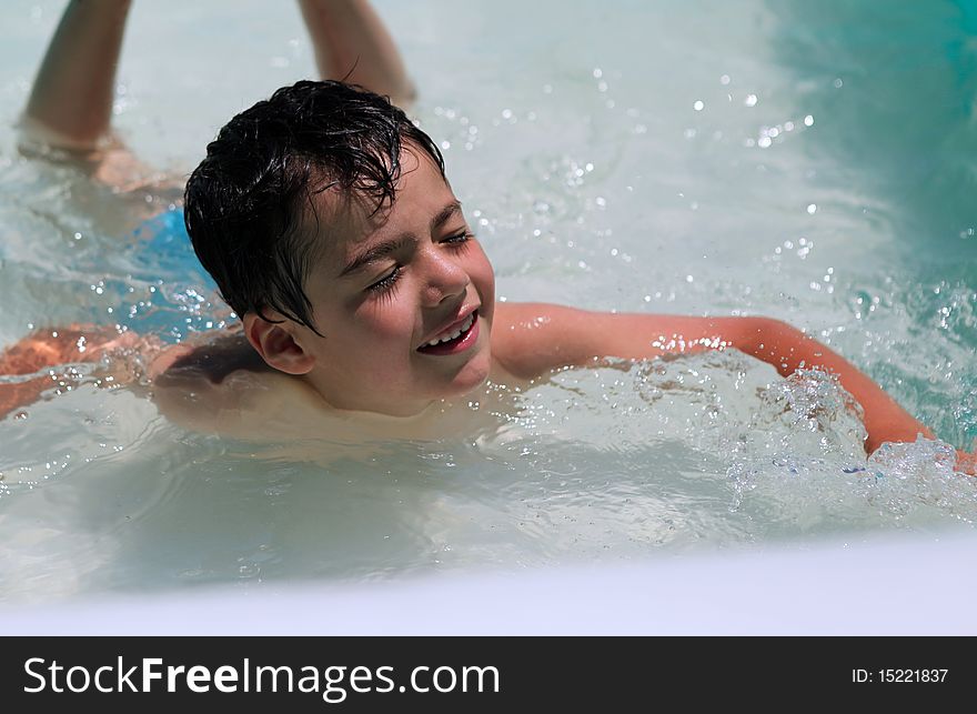 Happy child a swimming pool