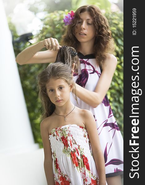 Portrait of happy mother with daughter having good time in summer environment. Portrait of happy mother with daughter having good time in summer environment