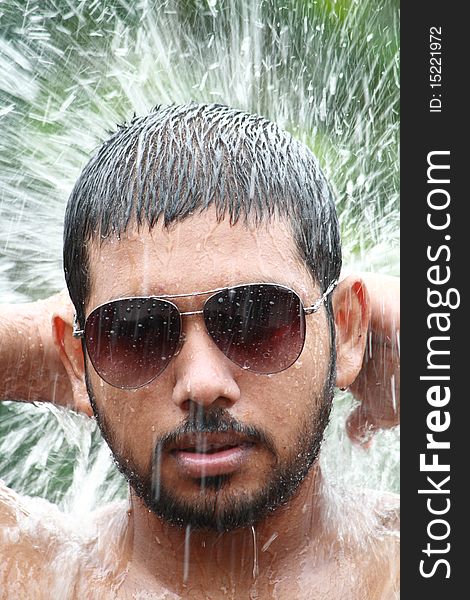 Portrait of a man in water splash. Portrait of a man in water splash