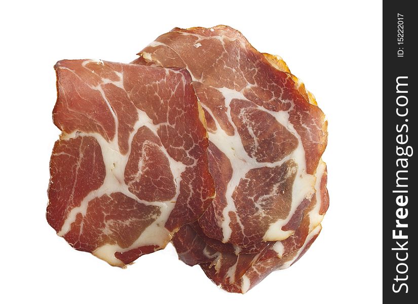 Tasteful slice of ham isolated on white