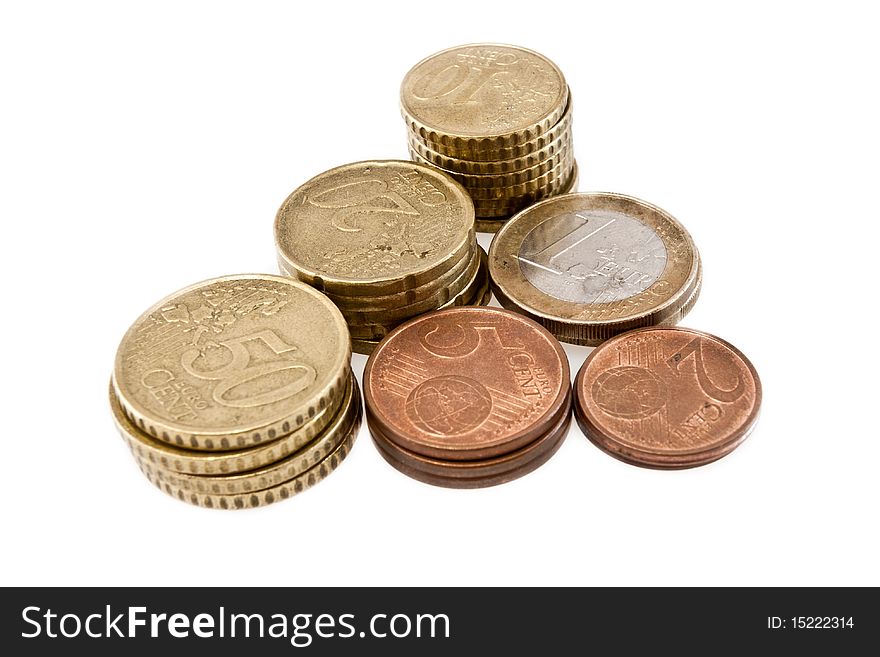 Euro and cent coins from the European Union isolated on white background in a pyramidal form. Euro and cent coins from the European Union isolated on white background in a pyramidal form
