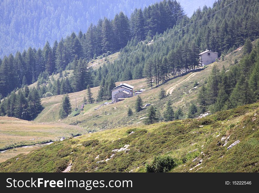 Fields and houses by Madesimo SO Italy