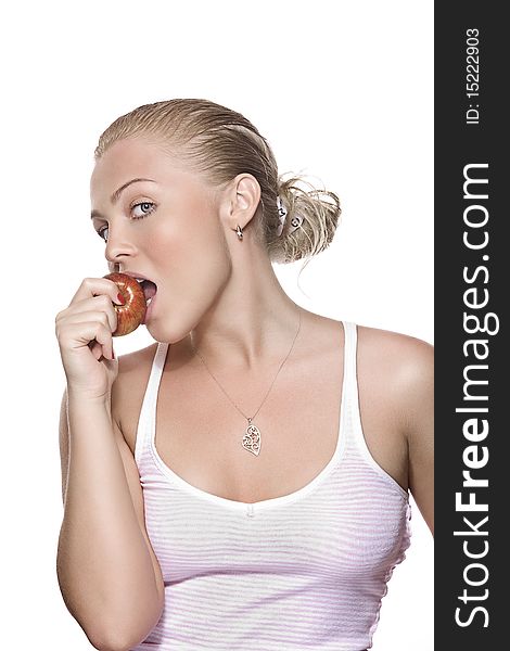 Portrait of young beautiful woman biting apple on white back. Portrait of young beautiful woman biting apple on white back