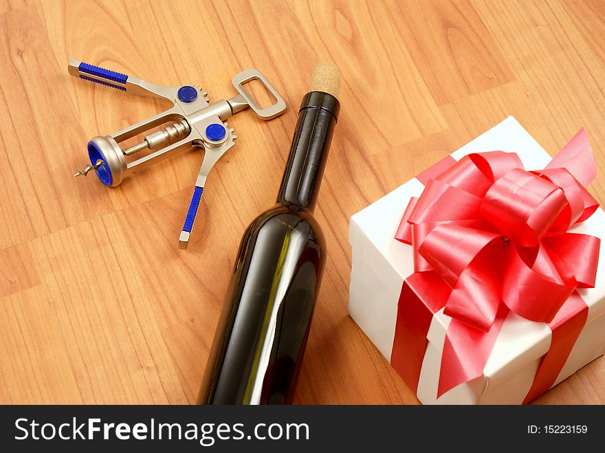 Red wine glass, gift box and opener