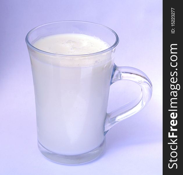 Milk In A Glass On A Blue Background