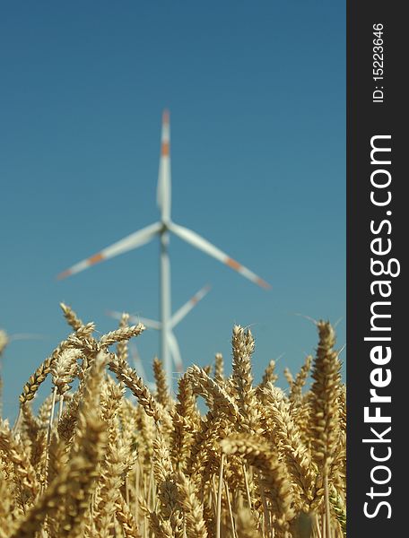 Wind turbine on blue sky background