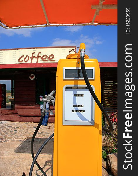 Antique yellow gas station at a coffee shop. Antique yellow gas station at a coffee shop.