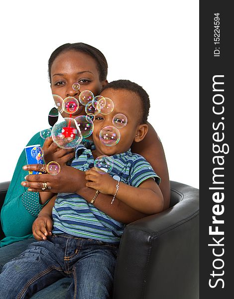 Young afro american family with bubbles