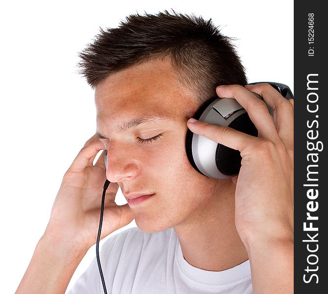 Young fresh teenager with headphones isolated over a white background. Young fresh teenager with headphones isolated over a white background.