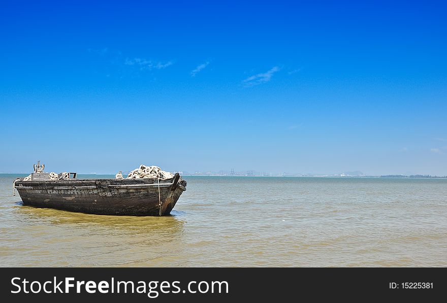 Floating Wooden Boat and Blue sky