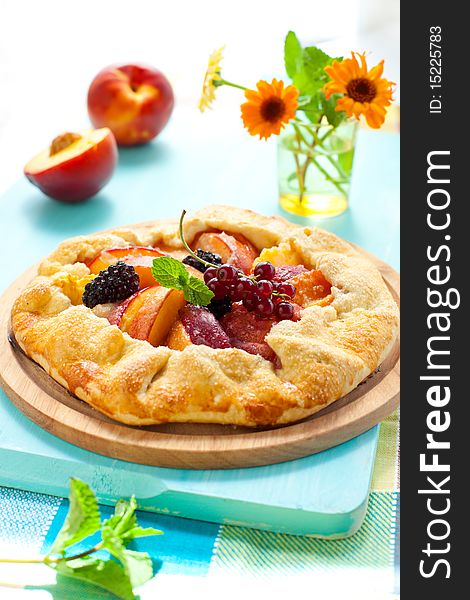 Peach galette with blackberry and red currant. Peach galette with blackberry and red currant