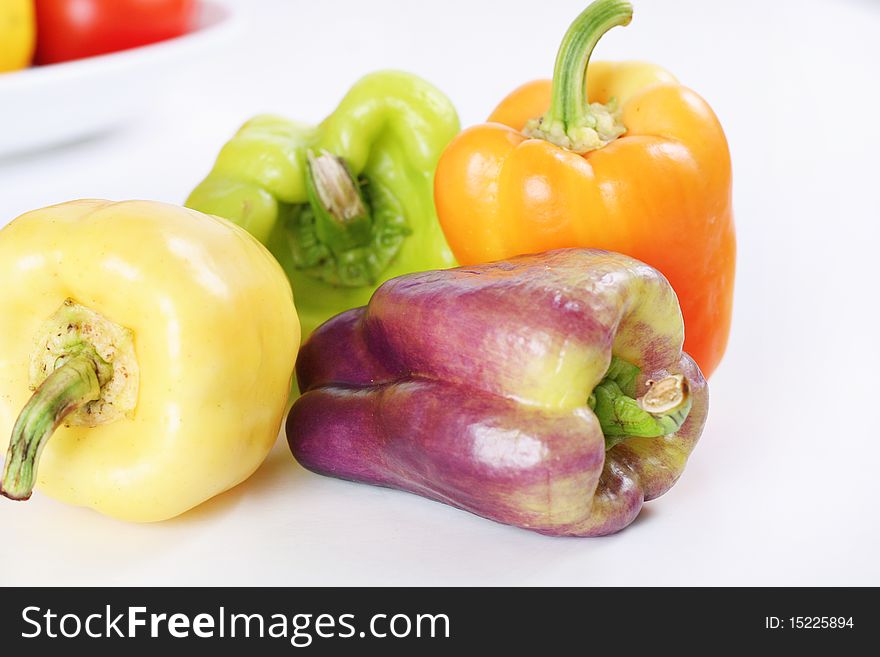 Shot of purple, yellow, orange & green baby bell peppers