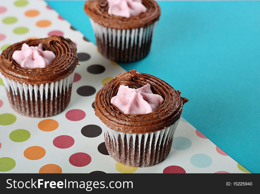 Shot of polka dot raspberry filled cupcakes