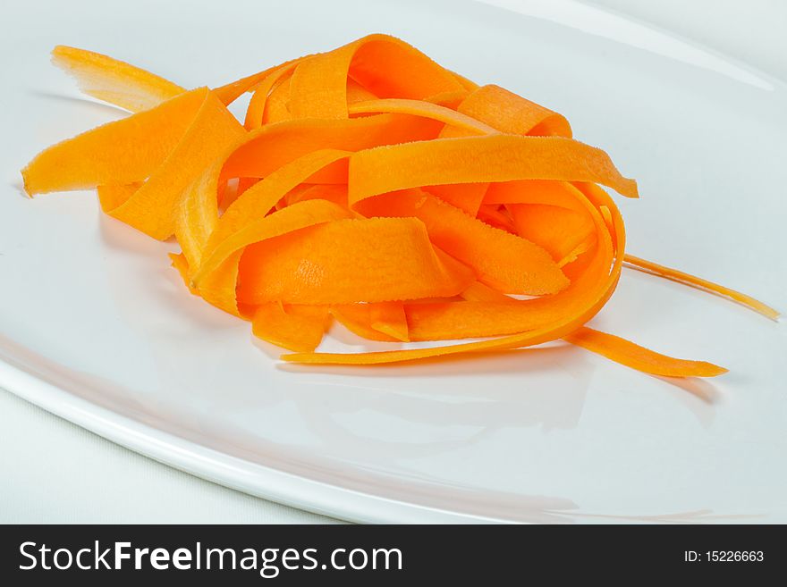 Slices of carrots on a white plate