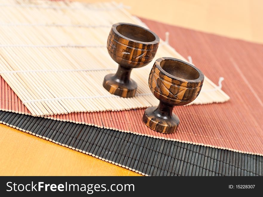 Japanese Sake Mini Cups on Colored Mats. Japanese Sake Mini Cups on Colored Mats