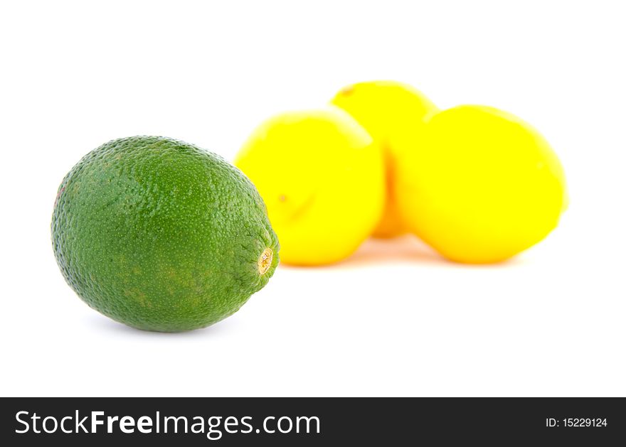 A group of one limes and three lemons on a white background. A group of one limes and three lemons on a white background