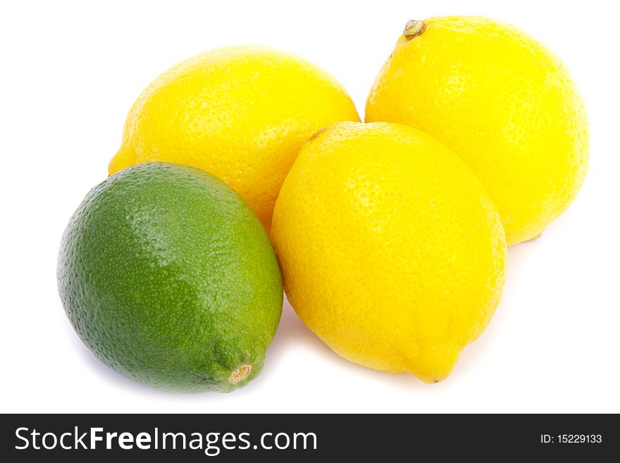 A group of one green limes and three yellow lemons on a white background. A group of one green limes and three yellow lemons on a white background