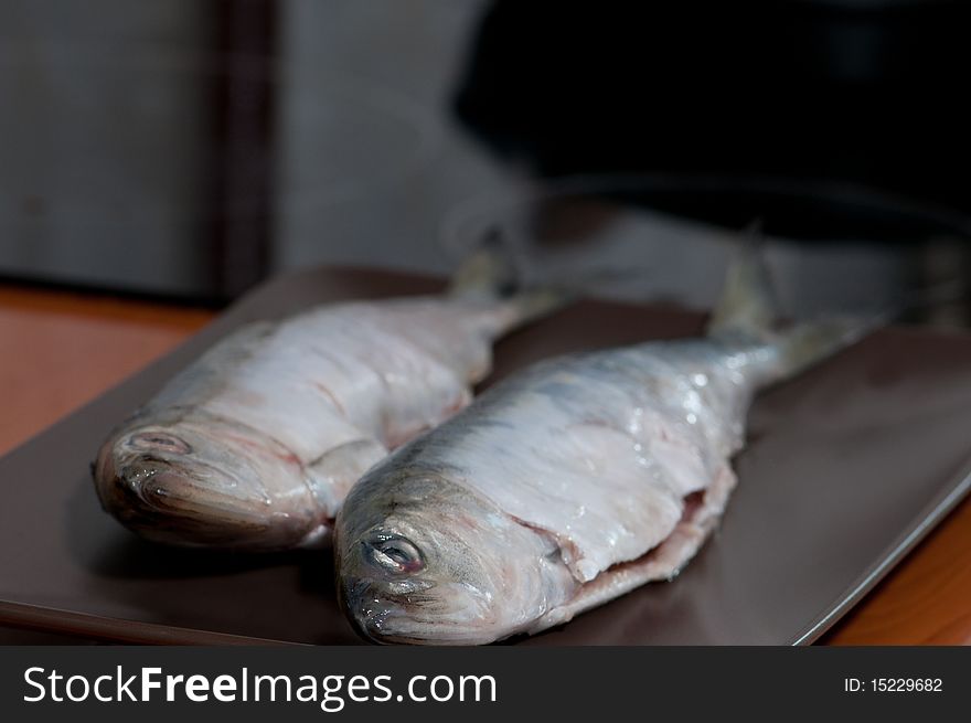 Two fishes waiting to get fried.