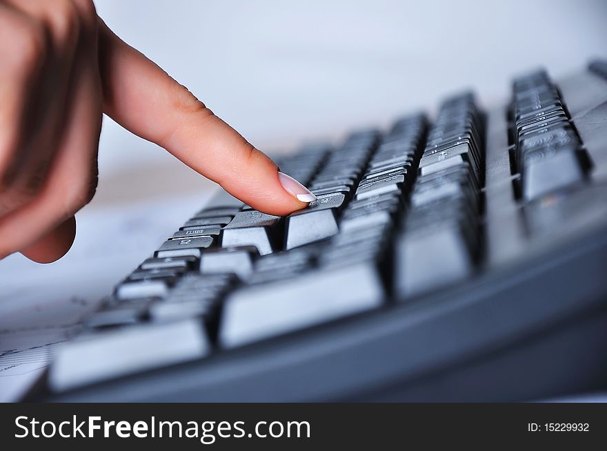 Hands of a young woman presses the keyboard. Workplace businessman